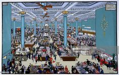 an illustration of people shopping in a mall with blue columns and ceiling lights on either side