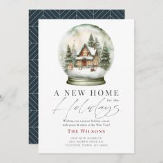 a snow globe christmas card with the words, new home holidays in red and green