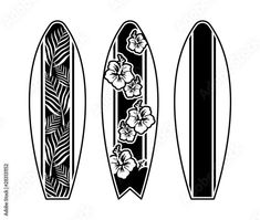 three surfboards with flowers and leaves on the bottom, one is black and white