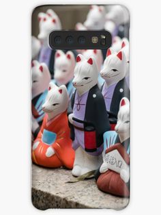 a group of ceramic cats sitting next to each other on a stone surface samsung snap case