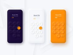 three remote controls sitting next to each other on a white surface with orange and purple buttons