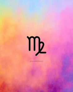 the letter m is written in cursive writing on a multicolored background