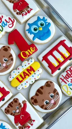 decorated cookies in the shape of animals and numbers