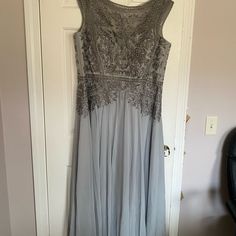 Reposhing This Item I Purchased From @Plrmonk. It Just Arrived And Sadly Is Too Big On Top. Gorgeous Gown. Would Be A Perfect Mob Dress Or For A Fancy Event. Bodice Has A More “Moulded” Shape. For Reference, I’m An 18, 40c Bust, And Think This Is Generously Sized With Very Roomy Bust. Bodice Comes To A Flattering Waist Cinch, And Then Falls With Beautiful Cascades Of Skirting. Quite Beautiful Classy Gown. I Wish It Fit. Comes In The Nice Quality Dress Bag That Original Seller Shipped To Me In. B Mother Of The Bride Floor-length Evening Dress, Mother Of The Bride Dress With Sweep Train, Embellished Sleeveless Evening Dress For Mother Of The Bride, Floor-length Embellished Mother Of The Bride Dress, Embellished Floor-length Mother Of The Bride Dress, Floor-length Sequin Gown For Mother Of The Bride, Sequined Floor-length Mother Of The Bride Dress, Beaded Floor-length Mother Of The Bride Evening Dress, Gray Embellished Floor-length Gown