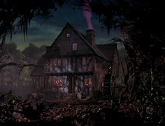 a creepy house in the woods at night