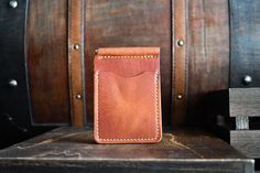 "This traditional money clip wallet is handcrafted with full grain Horween leather. There are a total of four card pockets that will hold multiple cards in each slot. This wallet comes with a spring clip in the middle that will hold your cash securely. This product is available for free personalization! FEATURES - 100% handmade in the USA - Guaranteed to last a lifetime - Complimentary personalization - Great for gifts - Full grain leather - Leather will age and patina beautifully over time - Al Handmade Rectangular Wallets For Everyday Carry, Handmade Rectangular Wallet For Everyday Use, Handmade Rectangular Wallet For Everyday Carry, Handmade Everyday Rectangular Wallet, Handmade Rectangular Everyday Wallet, Handmade Classic Wallet, Leather Money Clip, Leather Money Clip Wallet, Leather Money Clips