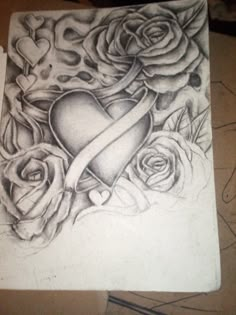 a drawing of roses and a heart on paper