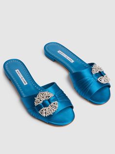 Find MANOLO BLAHNIK 10mm Pralina Satin Slide Sandals on Editorialist. 10mm Heel. Satin upper. Slip on. Crystal buckle detail. Leather lining and insole. Leather sole Beach Flats, Manolo Blahnik Heels, Versace Brand, Ski Accessories, Fancy Shoes, Loafer Mules, Mule Sandals, Flat Espadrilles, Dream Shoes