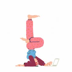 a person doing a handstand while using a laptop on the floor with their legs spread out