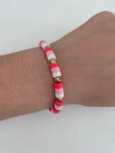 a person's arm with a bracelet on it