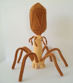 a crocheted spider sitting on top of a white surface with the words pattern written below it