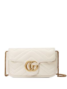 Gucci Marmont ivory matelassé leather super mini shoulder bag with Double G golden hardware. Made in Italy Color: IvoryComposition: 100% leatherCare instructions: Wipe with a soft and dry cloth Dimensions: H 10 x W 16 x D 4.5 cmInterior open pocketAttached key ring that can attach to a separate bagAdjustable chain shoulder strap White Gucci Bag, Gg Marmont Super Mini Bag, Gg Marmont Matelassé Mini Bag, Gg Marmont Mini Bag, Gucci Super Mini, Gucci Gg Marmont Matelasse, Gg Marmont Mini, Gucci Mini, Gucci Crossbody Bag