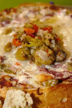 a close up of a pizza with cheese and toppings