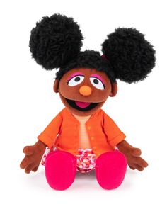 the muppet doll is wearing an orange shirt and pink pants with her hair in pigtails