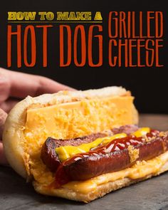 a hot dog with cheese and ketchup on it