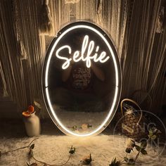 a person taking a selfie in front of a mirror with the word selfie on it