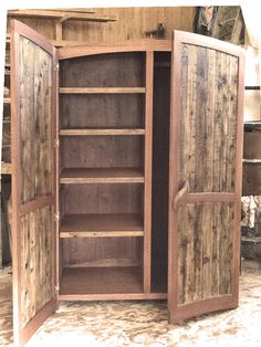 an open wooden cabinet with doors and shelves