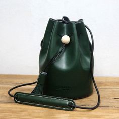 Overview: Design: Cute LEATHER WOMEN Bucket SHOULDER BAG Barrel Crossbody Purses FOR WOMENIn Stock: 3-5 days For MakingInclude: A Shoulder BagCustom: NoLeather: CowhideMeasures: L 21cm x W 15cm x H 15cmWeight: 0.43 kgSlots: 1 main slot, 1 inner slot,Accessories(option): NoneStyle: Cute LEATHER WOMEN Bucket SHOULDER BAG Barrel Crossbody Purses FOR WOMENVery durable (At least 5 Years) and it should last a life time Note: Each Item will have very slight variances to the pictured Item, and the conse Overview Design, Leather Ideas, Handbags Luxury, Purses For Women, Bucket Bags, Handbags And Purses, Felting Tutorials, Leather Bucket Bag, Leather Bucket