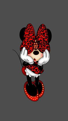 the mickey mouse is dressed in red and black with leopard print on his head, while he