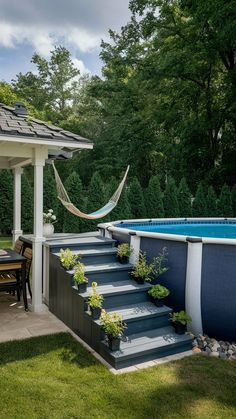 a pool with steps leading to it and a hammock hanging from the roof