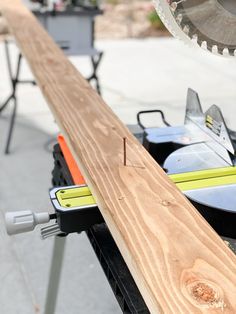 a close up of a piece of wood being cut with a circular sawtoother