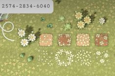 an overhead view of flowers and letters on the ground