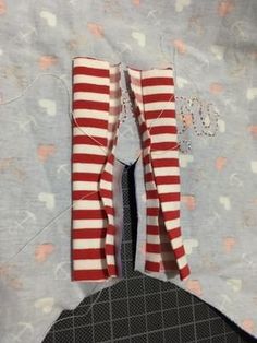 two pieces of red and white striped fabric