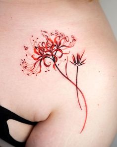 the back of a woman's stomach with red flowers on it