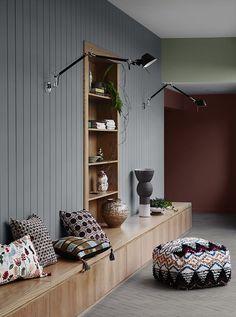 a living room filled with lots of furniture and decor