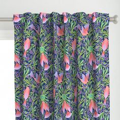 a curtain with pink flowers and green leaves on blue background, hanging in front of a window