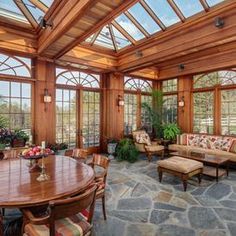 the inside of a house with french doors and windows on each side of the room