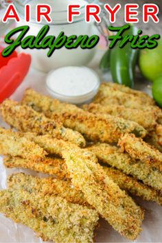 air fryer jalapeno fries on a plate with dipping sauce and green peppers