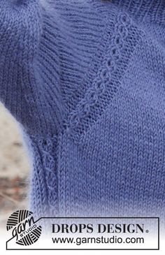 a close up of a person wearing a blue sweater