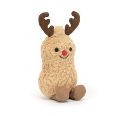 a small stuffed animal with antlers on it's head and legs, sitting down