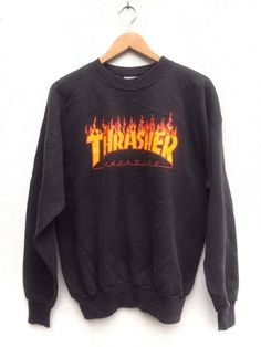 "Please read all description carefully before buying. If you have any questions feel free to ask. Vintage 90's Thrasher Magazine Flame Sweatshirt Colour : Black Size on tag : L Brand : Thrasher Condition : Good vintage condition but slightly faded. MEASUREMENT Armpit to armpit : 23\" Shoulder to bottom hem : 26.5\" PLEASE CHECK ACTUAL SIZE CAREFULLY, NO RETURNS OR COMPLAINT FOR WRONG SIZE ACTUAL. ACCEPT PAYPAL ONLY. Shipping cost=$28 via DHL Express Shipping. Transit time can take 3-5 business d 90s Winter Streetwear Tops, 90s Style Winter Streetwear Tops, 90s Cotton Sweatshirt For Streetwear, 90s Style T-shirt For Fall Streetwear, Grunge Crew Neck Top For Skateboarding, 90s Style Streetwear Tops With Ribbed Cuffs, 90s Style Ribbed Cuffs Tops For Streetwear, 90s Style Tops With Ribbed Cuffs For Streetwear, Winter Vintage Streetwear T-shirt