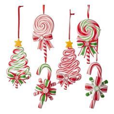 candy canes and christmas decorations hanging from strings