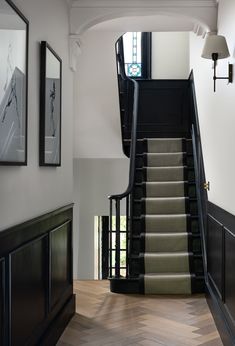 an elegant staircase leading up to the second floor