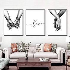 two black and white prints with hands holding each other