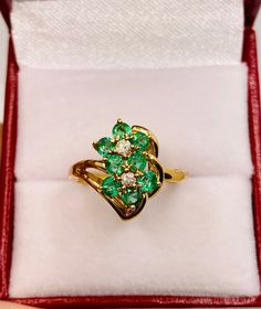 Beautiful Vintage 14k Yellow Gold Natural Fine Quality Round Shape Emerald Ring 100% Natural Emeralds And Diamonds Emerald(s) 1.00CT Diamond: 0.08CT Color: G Clarity: SI1 Total ring weight: 3.9GR 14k Yellow Gold Ring sizing available free of charge For more information regarding this item feel free to reach me so I can accommodate your needs. Thank you 14k Gold Cluster Diamond Ring, 14k Gold Cluster Diamond Ring Fine Jewelry, Exquisite Yellow Gold Multi-stone Diamond Ring, Emerald Cluster Jewelry With Brilliant Cut, Fine Jewelry Yellow Gold Multi-stone Diamond Ring, Fine Jewelry Yellow Gold Cluster Diamond Ring, Yellow Gold Multi-stone Jewelry For Anniversary, Luxury Yellow Gold Cluster Emerald Ring, Luxury Cluster Emerald Ring In Yellow Gold