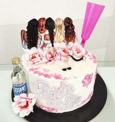 there is a wedding cake with three brides on it