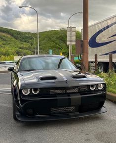 a black sports car parked on the side of the road