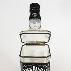 a bottle of jack daniels whiskey sitting on top of a table