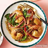 shrimp and vegetable stir fry with rice on a plate