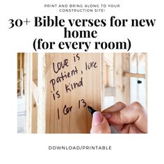 a person writing on a piece of wood with the text bible verses for new home for every room