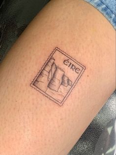 a person with a small tattoo on their arm that reads girl and has a stamp in it