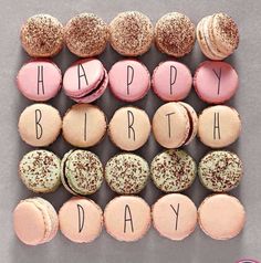 a happy birthday card with macaroons and doughnuts arranged in the shape of letters