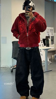 a man is taking a selfie in front of a mirror wearing some kind of helmet