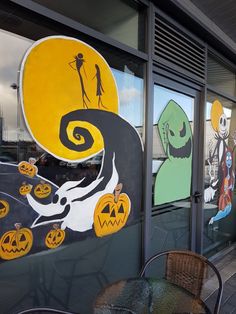 there are many halloween themed windows on this building