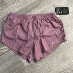 Nike Embossed Shorts These 3" Shorts Stay Light And Breezy Throughout Your Run. Sleeker Than The Original Tempo Shorts, This Version More Closely Follows The Shape Of Your Body. Built-In Briefs Eliminate The Need For Another Layer. A Subtle Embossed Print Adds A Unique Look. Color: Mauve B2 Nike Cotton Shorts, Nike Shorts Women, Nike Tempo Shorts, Nike Spandex, Gymwear Outfits, Black Nike Shorts, Bermuda Shorts Women, Womens Athletic Shorts, Cute Nike Outfits