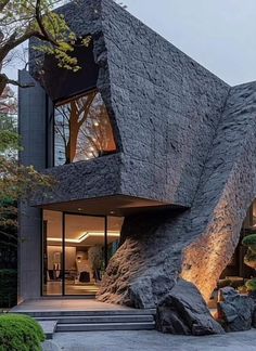 an unusual house made out of rocks and trees